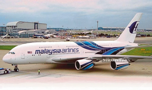 Hàng không Malaysia bỏ quy định bắt buộc đeo khẩu trang trên máy bay - ảnh 1