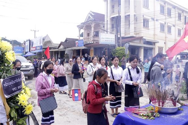 Cộng đồng người Việt tại tỉnh Oudomxay của Lào tri ân anh hùng liệt sỹ - ảnh 1